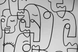 Minimalist abstract line art depicting faces on a white background.